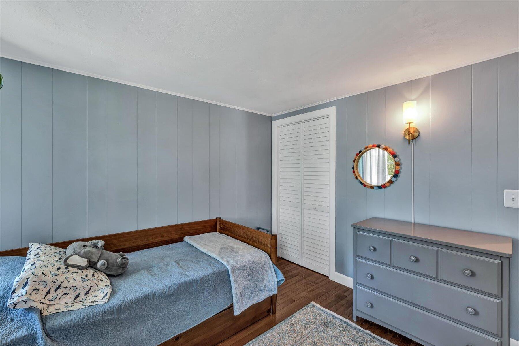 79 Clay Pond Road Monument Beach, MA 02532 - Photo 26 of 46 a bedroom with a bed and a dresser