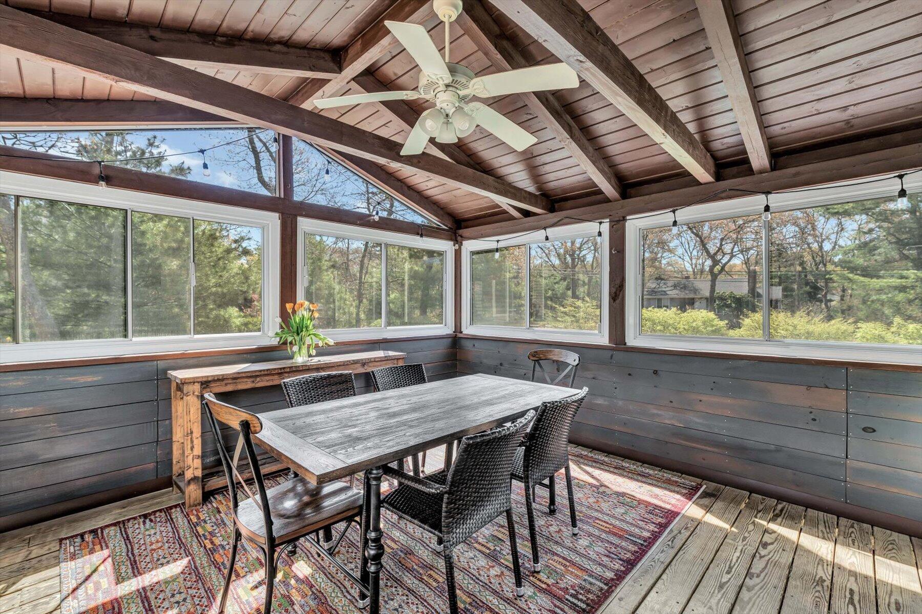 79 Clay Pond Road Monument Beach, MA 02532 - Photo 29 of 46 a view of a wooden table and chairs in patio