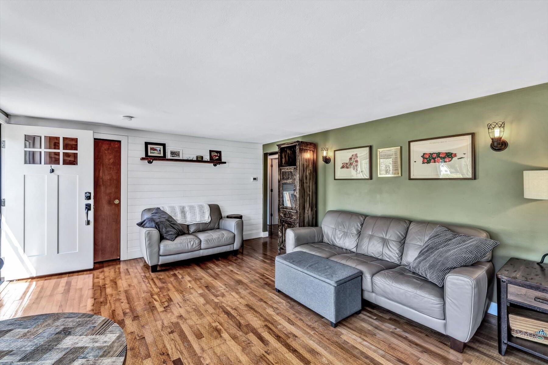 79 Clay Pond Road Monument Beach, MA 02532 - Photo 3 of 46 a living room with furniture and a couch