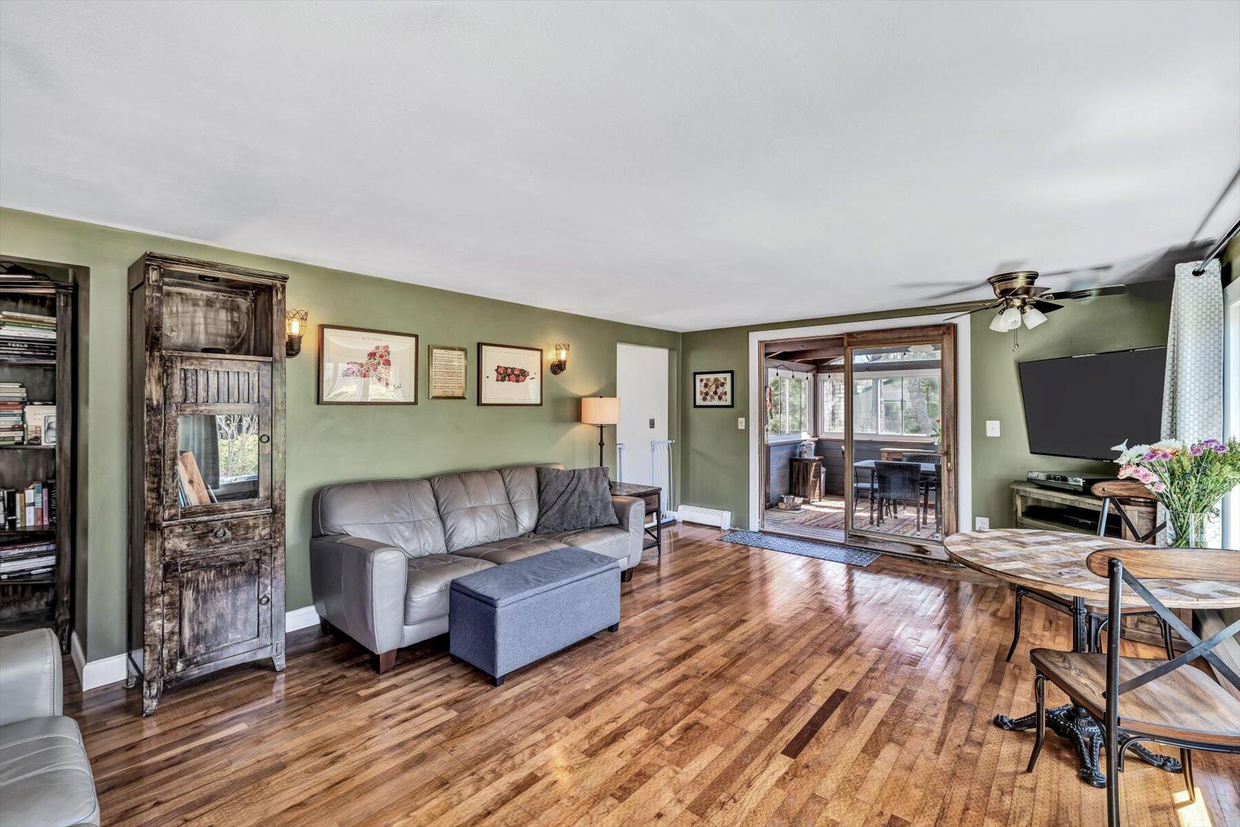 79 Clay Pond Road Monument Beach, MA 02532 - Photo 4 of 46 a living room with furniture and a flat screen tv