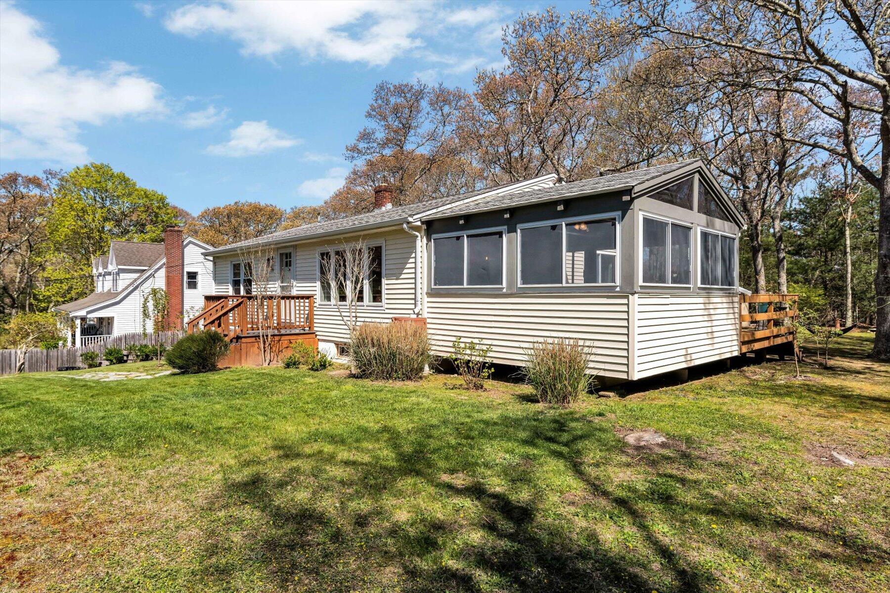 79 Clay Pond Road Monument Beach, MA 02532 - Photo 44 of 46 a front view of a house with a garden