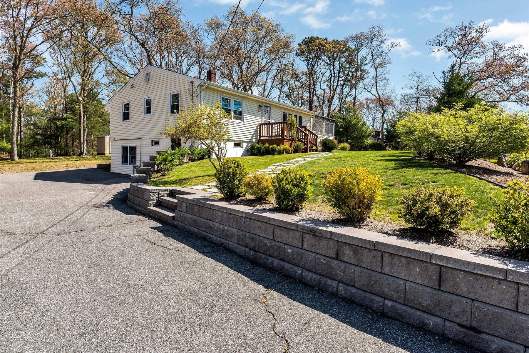 79 Clay Pond Road Monument Beach, MA 02532 - Photo 45 of 46 a front view of a house with garden