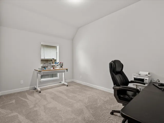 a view of a workspace with furniture