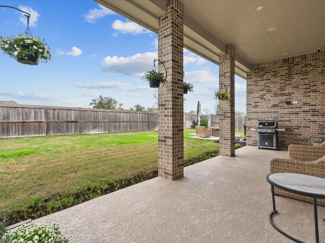 a view of a patio with a garden