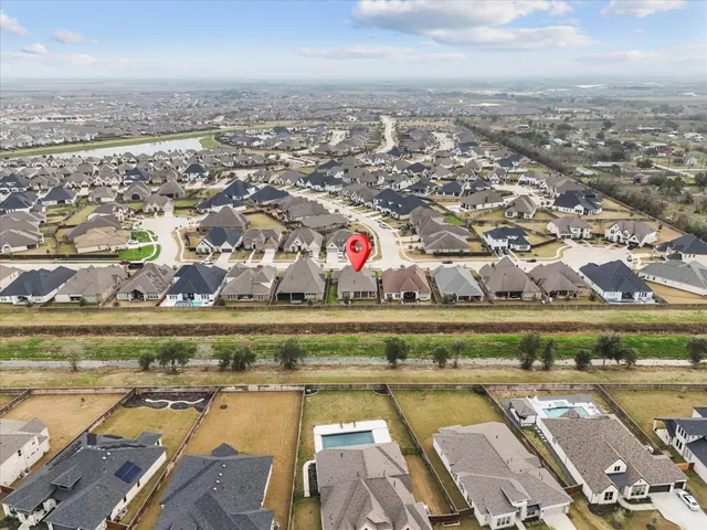 an aerial view of residential houses with outdoor space