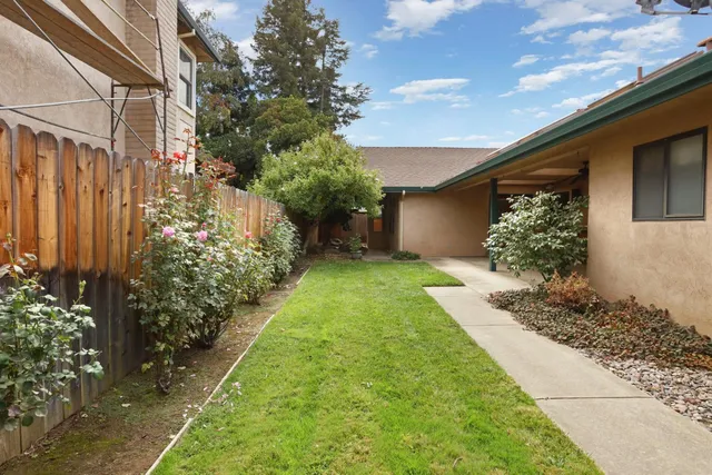 a backyard of a house with lots of green space