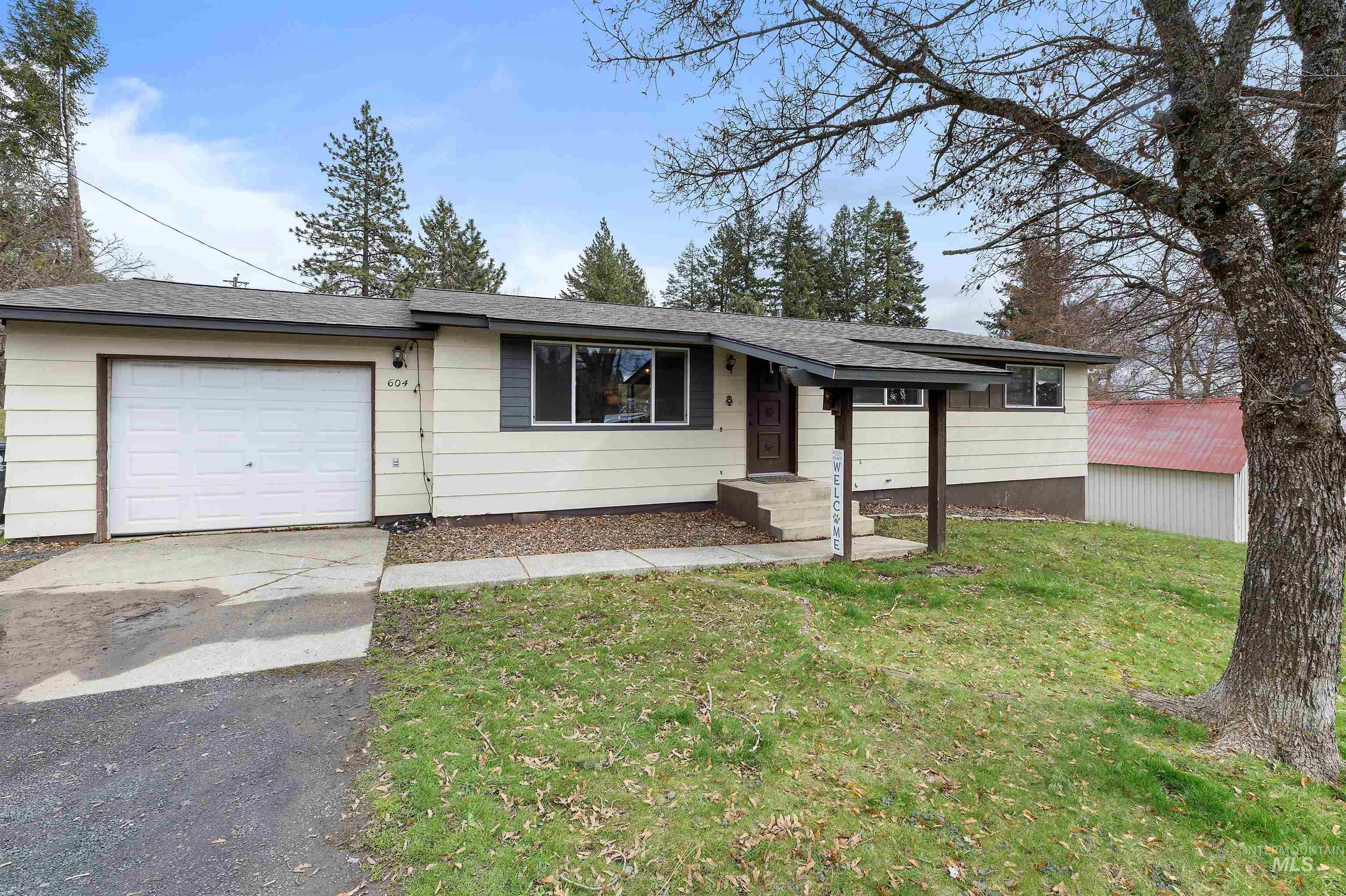 604 Line Street Deary, ID 83823 - Photo 22 of 28 Ranch-style home with a garage, driveway, a front lawn, and roof with shingles