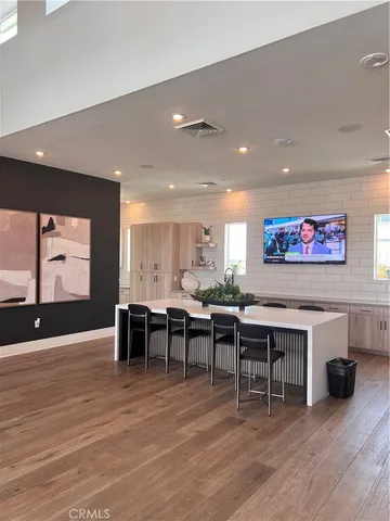 a view of a dining room with furniture wooden floor and chandelier