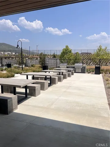 a outdoor space with lots of tables and chairs