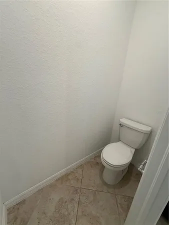 a room with a sink vanity and a mirror