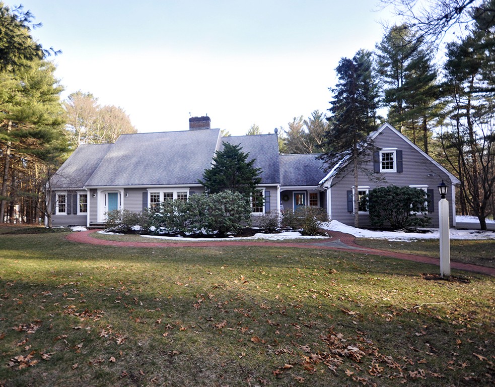 1055 Old Marlboro Road Concord, MA 01742 - Photo 1 of 19 a front view of a house with garden