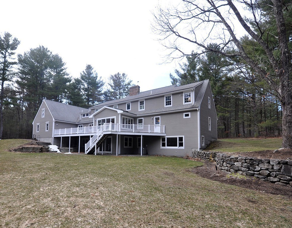 1055 Old Marlboro Road Concord, MA 01742 - Photo 13 of 19 front view of a house with a yard