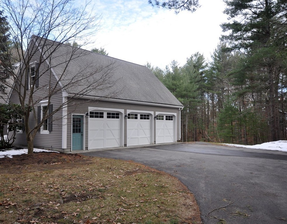 1055 Old Marlboro Road Concord, MA 01742 - Photo 16 of 19 a front view of house with yard and trees