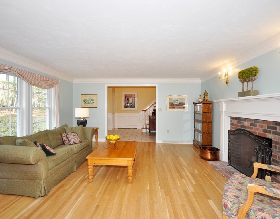 1055 Old Marlboro Road Concord, MA 01742 - Photo 3 of 19 a living room with furniture and a fireplace