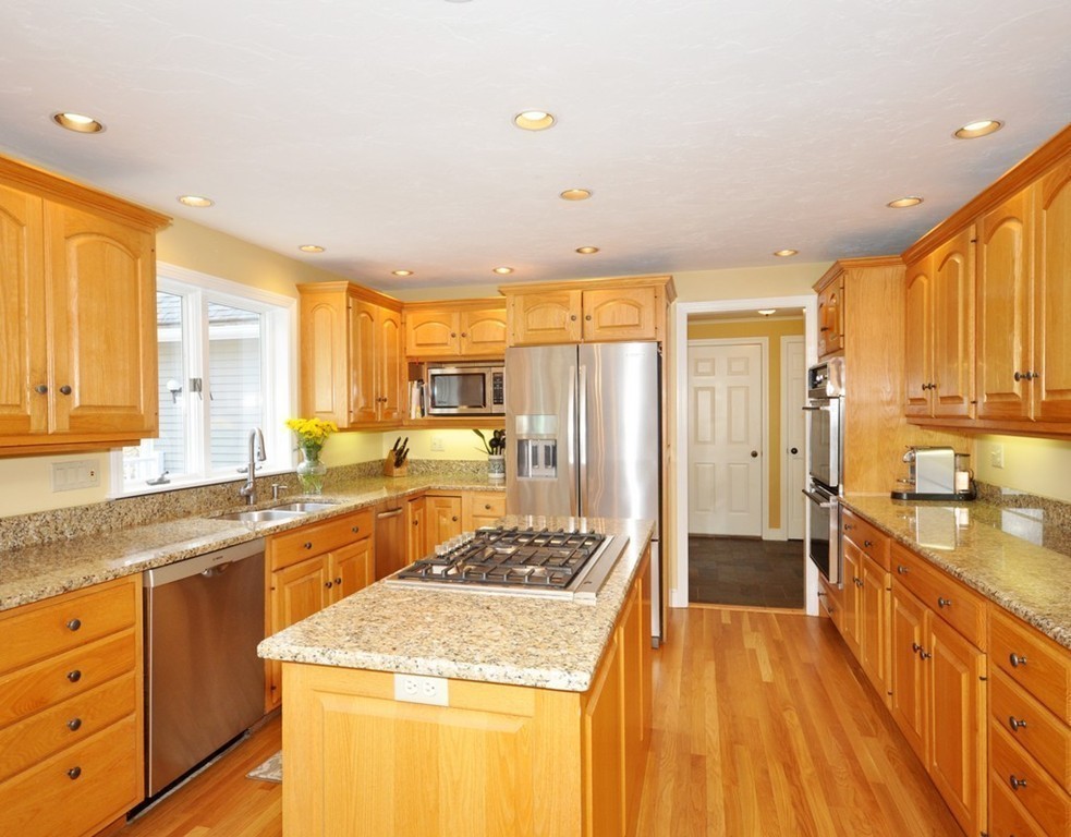1055 Old Marlboro Road Concord, MA 01742 - Photo 7 of 19 a kitchen with stainless steel appliances granite countertop a sink stove and refrigerator
