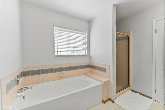 a white bath tub sitting next to a window