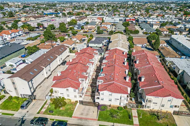 an aerial view of residential houses with outdoor space