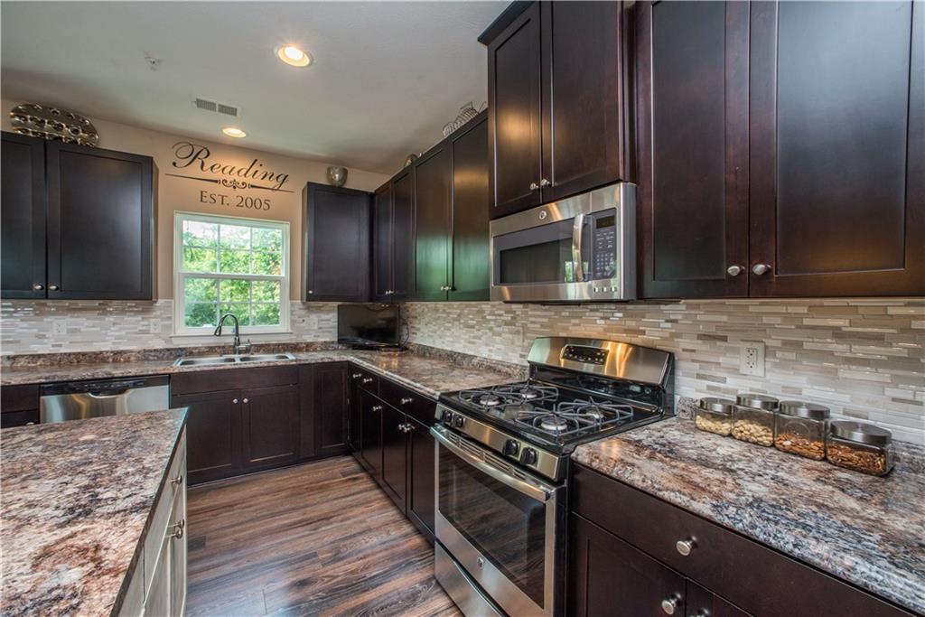 320 Maple Ridge Drive Canonsburg, PA 15317 - Photo 10 of 25 High definition counters, custom tile backsplash, SS appliances