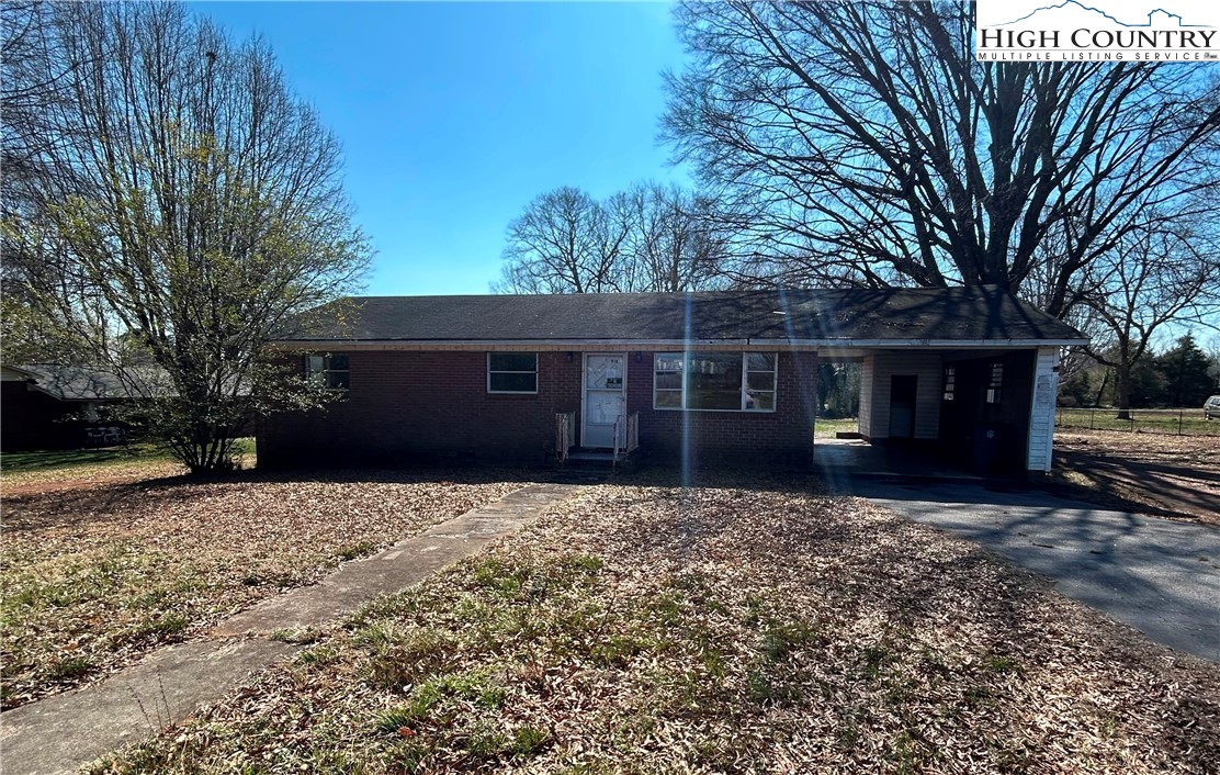 918 Emmanuel Church Road Conover, NC 28613 - Photo 1 of 17 a front view of a house with a yard and garage