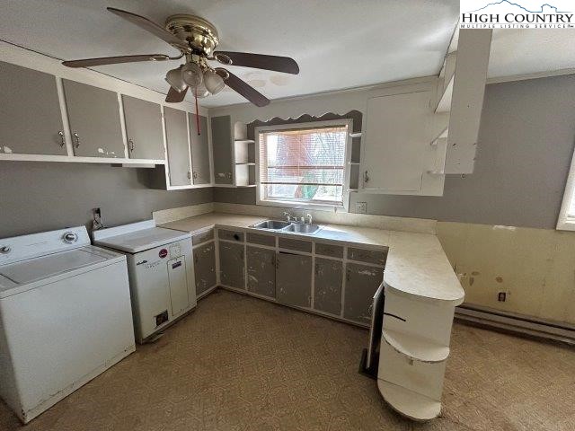 918 Emmanuel Church Road Conover, NC 28613 - Photo 2 of 17 a utility room with cabinets washer and dryer