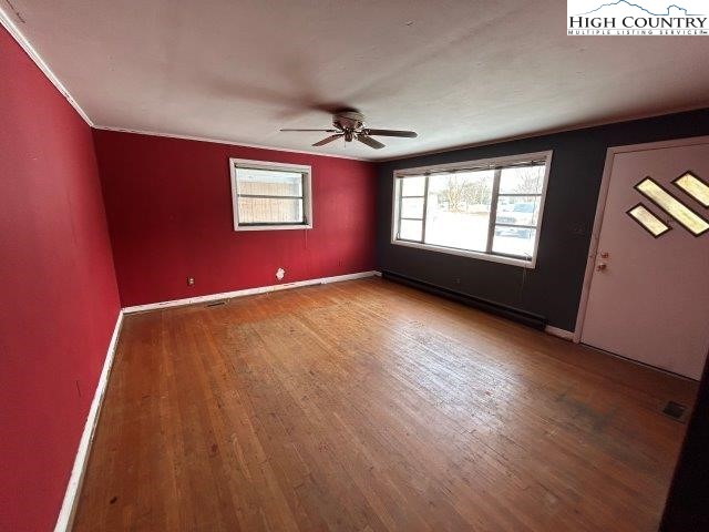 918 Emmanuel Church Road Conover, NC 28613 - Photo 9 of 17 wooden floor in an empty room with a window