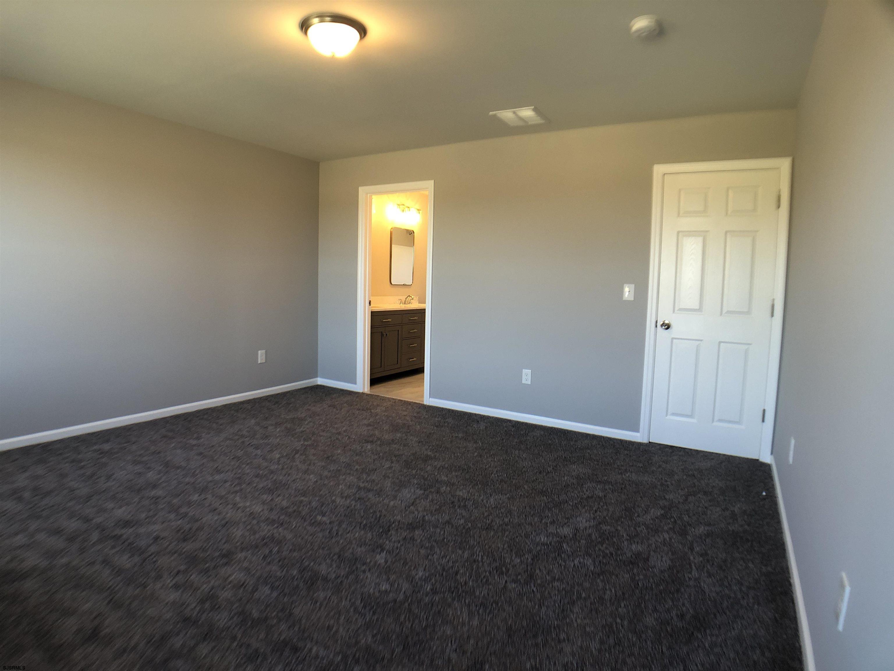 105 Wheat Road Vineland, NJ 08360 - Photo 16 of 30 an empty room with windows and closet