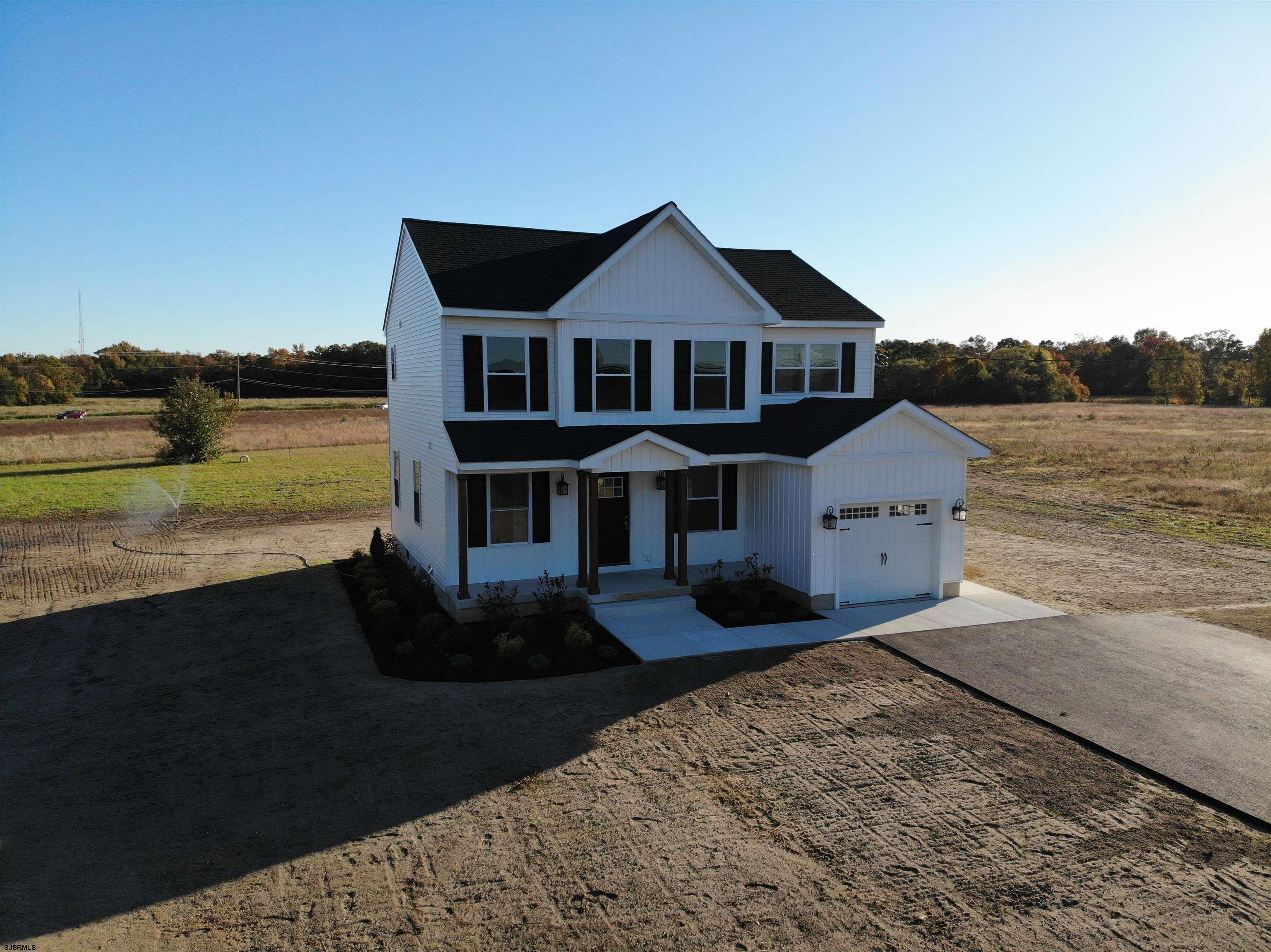105 Wheat Road Vineland, NJ 08360 - Photo 2 of 30 a front view of a house with a yard