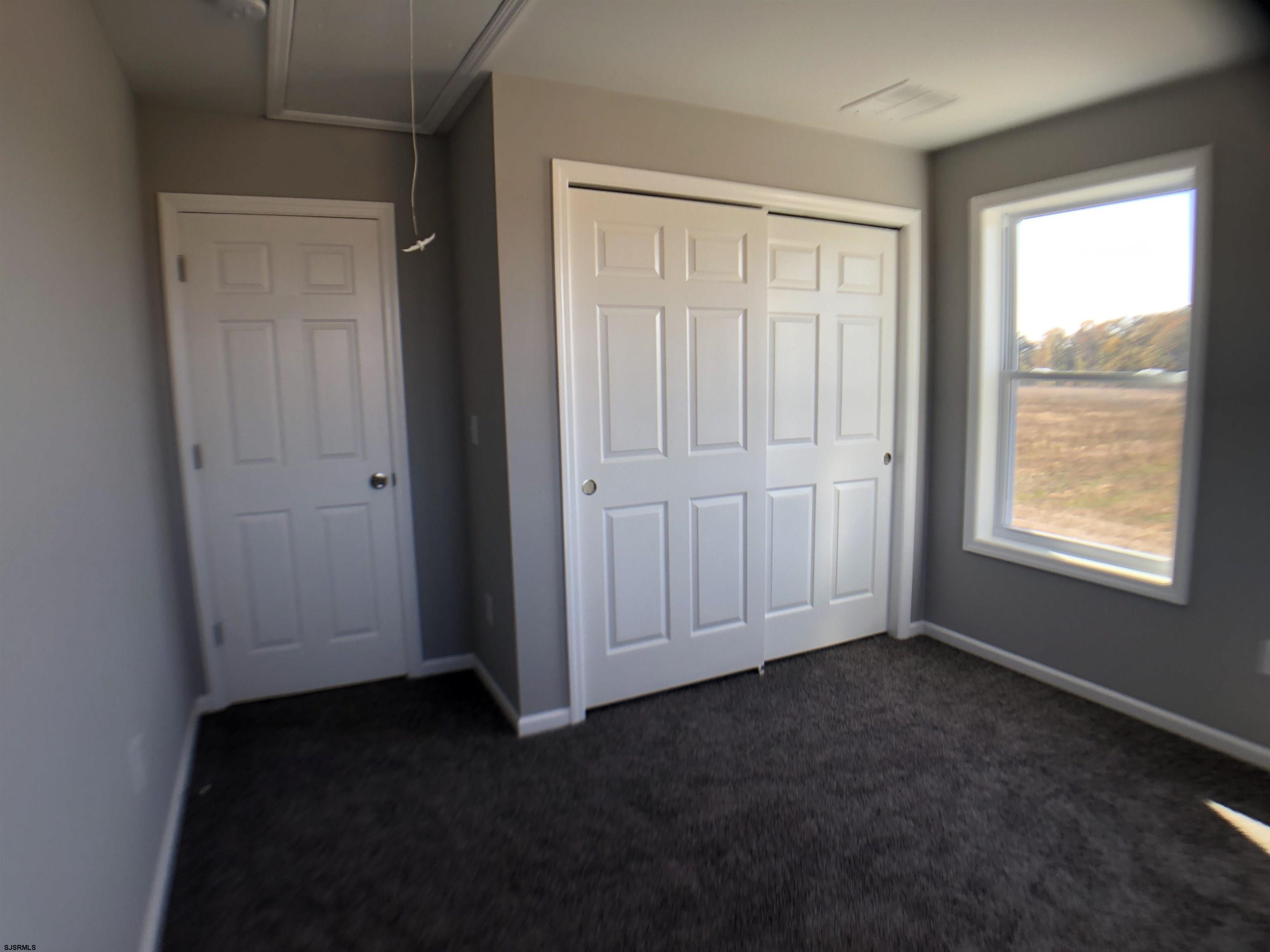 105 Wheat Road Vineland, NJ 08360 - Photo 21 of 30 an empty room with windows