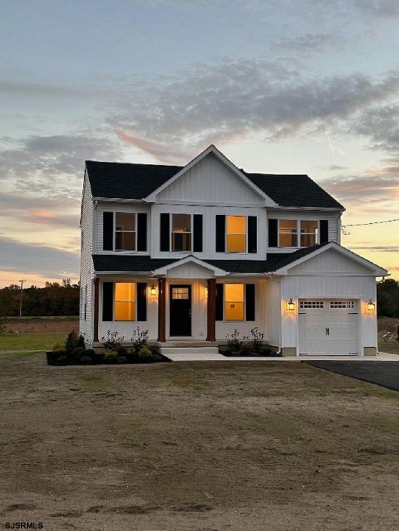 105 Wheat Road Vineland, NJ 08360 - Photo 3 of 30 a front view of a house with a garden