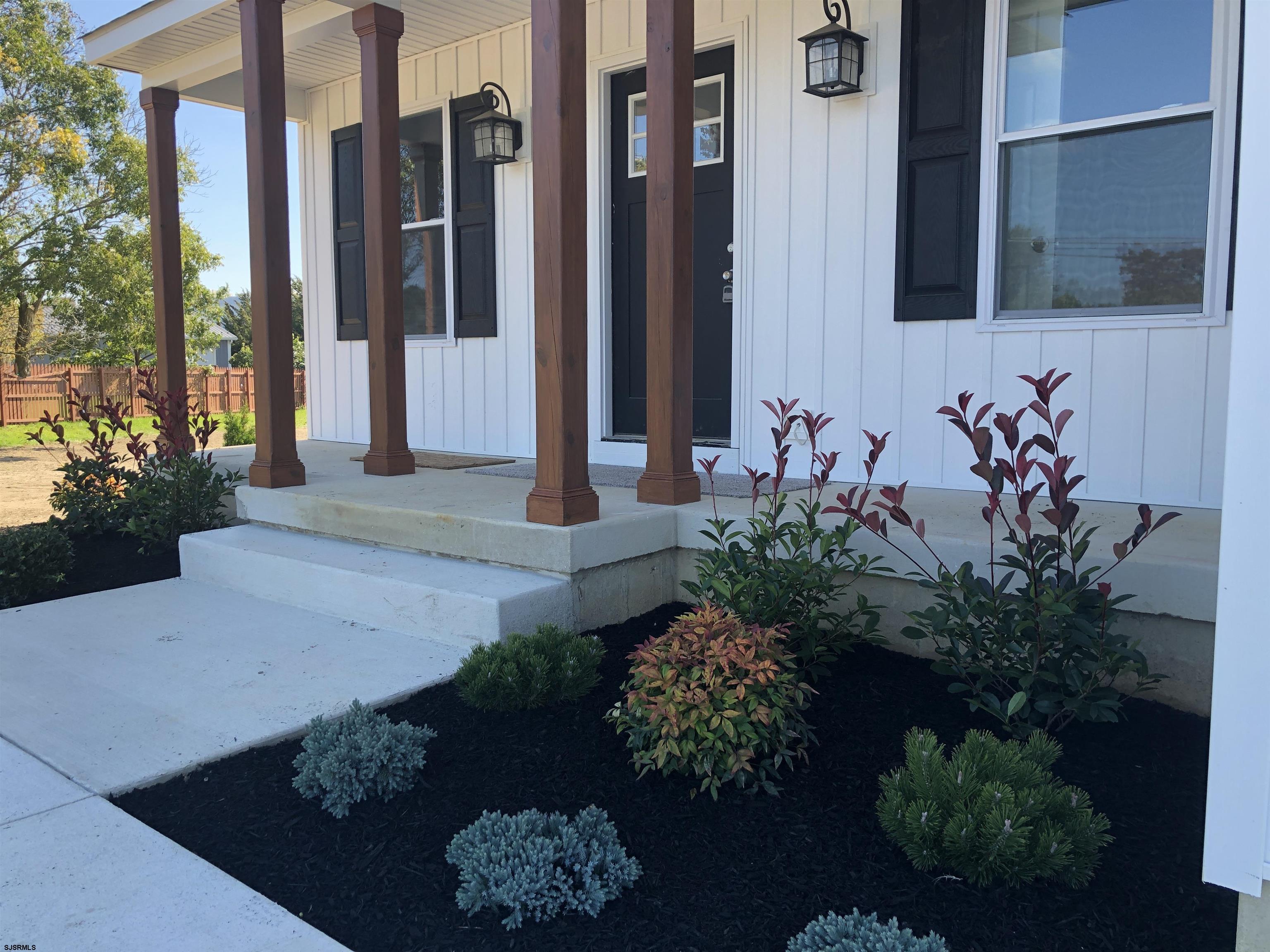 105 Wheat Road Vineland, NJ 08360 - Photo 4 of 30 a front view of a house with a yard