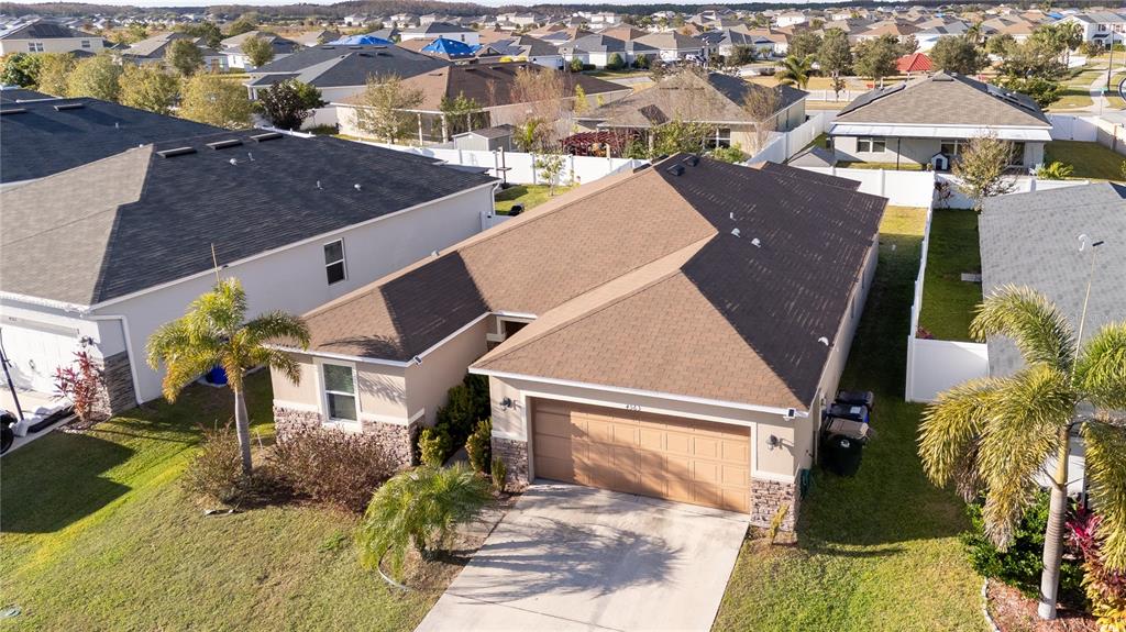 4563 Orchard Grove Road St. Cloud, FL 34772 - Photo 1 of 51 an aerial view of multiple houses with yard