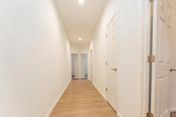 a view of a bathroom from a hallway