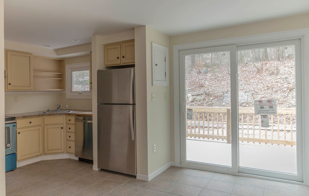 22 Sorel Road Ware, MA 01082 - Photo 4 of 15 a kitchen with cabinets and a refrigerator