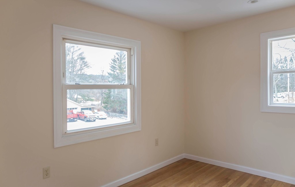 22 Sorel Road Ware, MA 01082 - Photo 9 of 15 an empty room with wooden floor and windows