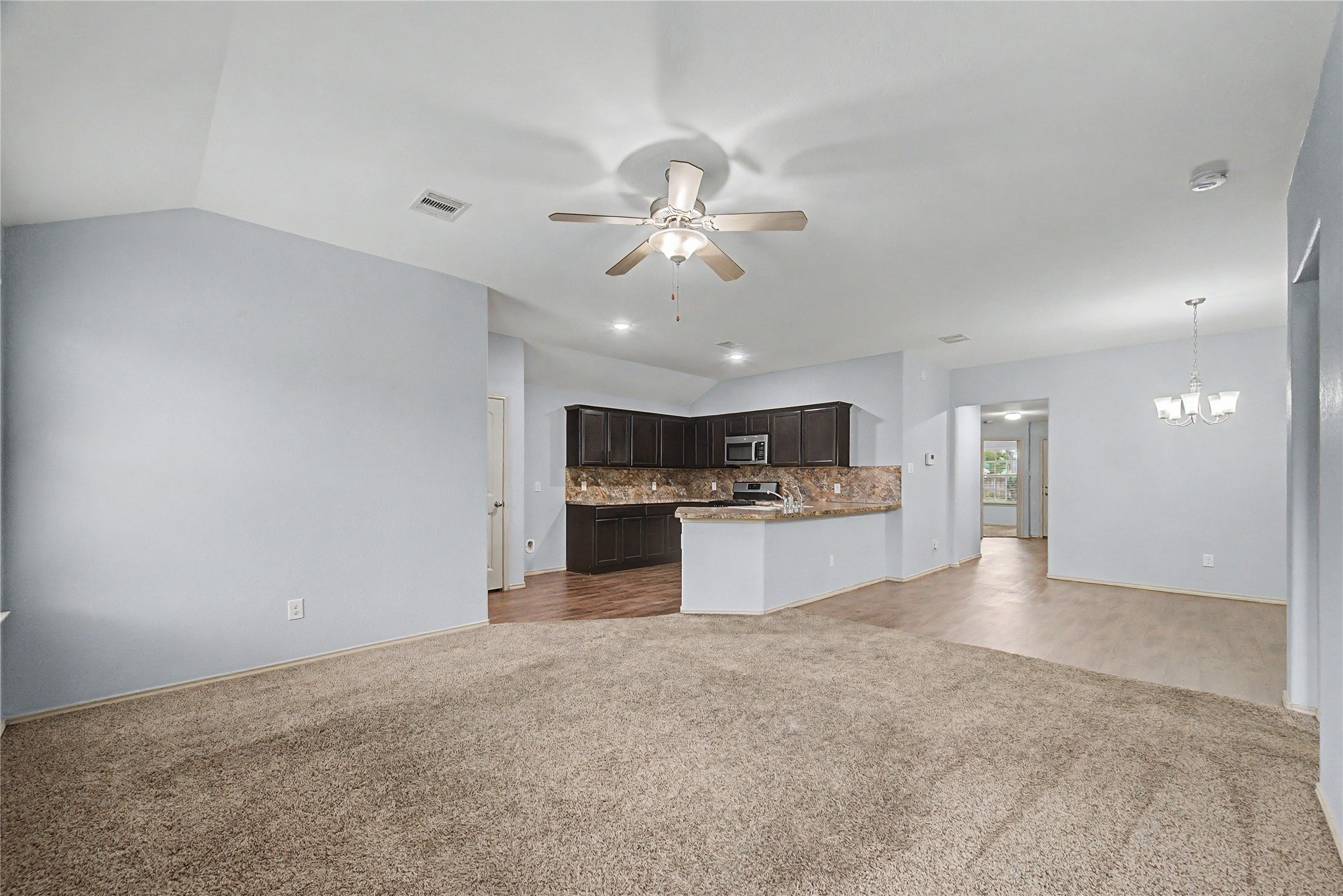 16430 Rodeo River Road Houston, TX 77049 - Photo 18 of 34 a view of a kitchen with a sink and a refrigerator