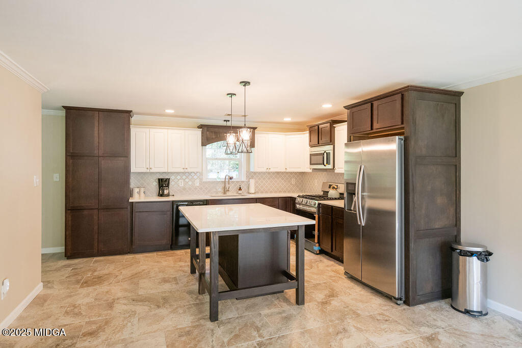 12820 Highway 87 Juliette, GA 31046 - Photo 11 of 57 a kitchen with refrigerator and chairs