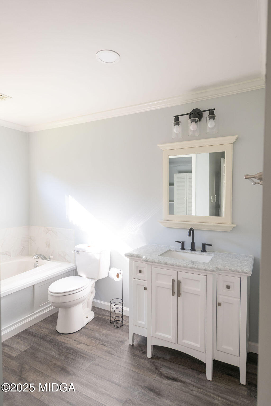 12820 Highway 87 Juliette, GA 31046 - Photo 25 of 57 a bathroom with a double vanity sink toilet and a mirror