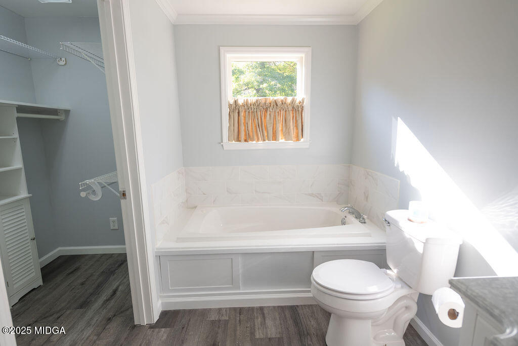 12820 Highway 87 Juliette, GA 31046 - Photo 26 of 57 a bathroom with a toilet a sink and bathtub