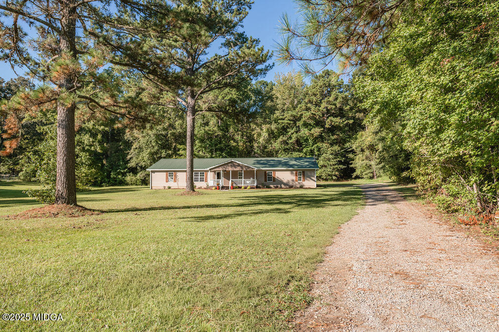 12820 Highway 87 Juliette, GA 31046 - Photo 3 of 57 a view of a swimming pool with an outdoor space