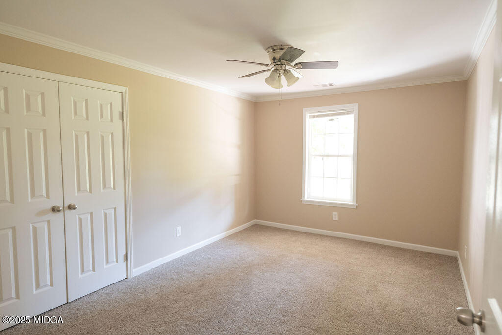 12820 Highway 87 Juliette, GA 31046 - Photo 35 of 57 an empty room with windows and fan