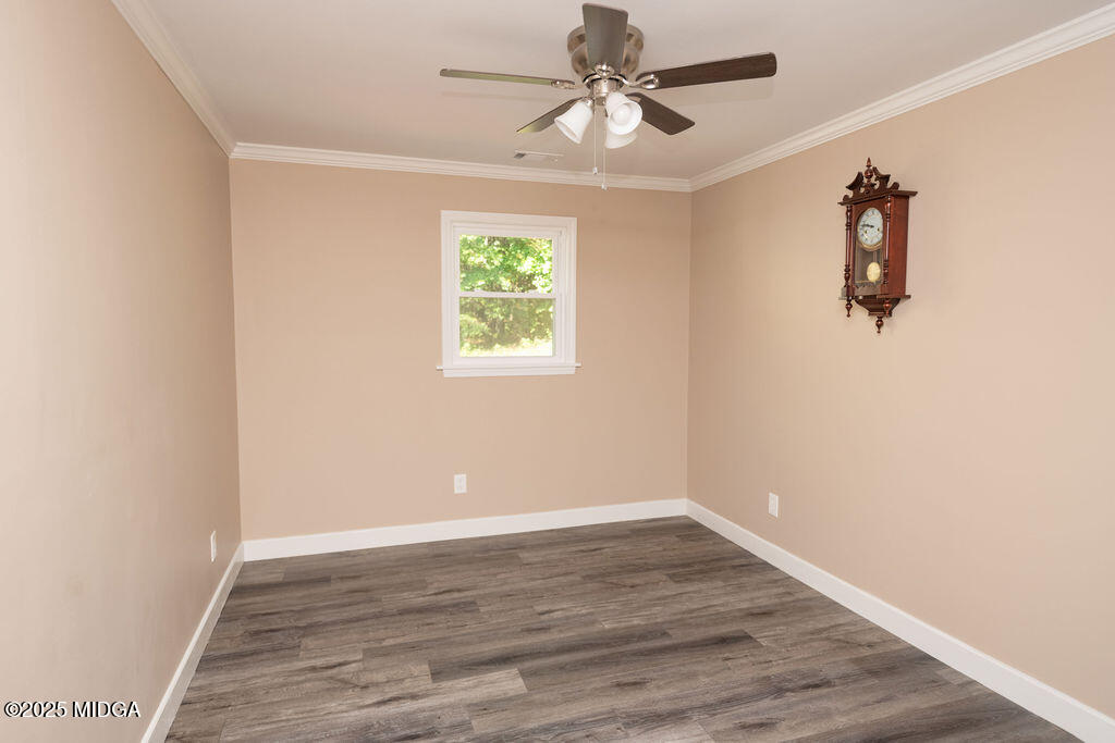 12820 Highway 87 Juliette, GA 31046 - Photo 44 of 57 wooden floor in an empty room with a window