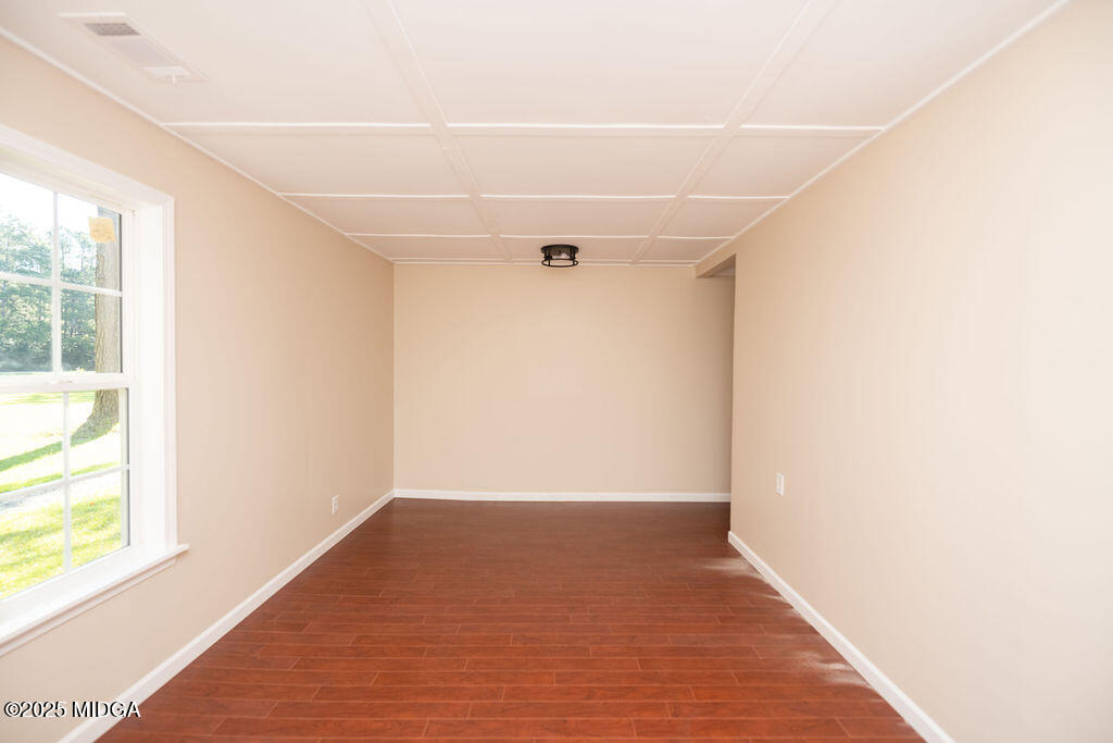 12820 Highway 87 Juliette, GA 31046 - Photo 47 of 57 a view of a big room with wooden floor and windows in a room