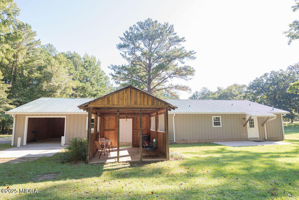 12820 Highway 87 Juliette, GA 31046 - Photo 52 of 57 a front view of a house with a yard garage and outdoor seating