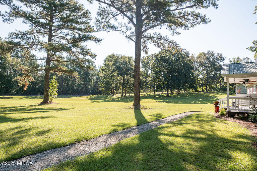 12820 Highway 87 Juliette, GA 31046 - Photo 56 of 57 a view of a swimming pool with a patio and yard of the house