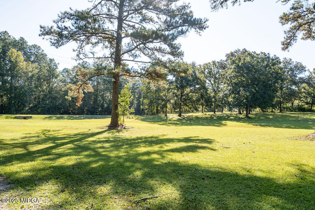 12820 Highway 87 Juliette, GA 31046 - Photo 57 of 57 a view of swimming pool with an outdoor space and seating area