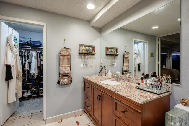 a bathroom with a sink double vanity and a mirror