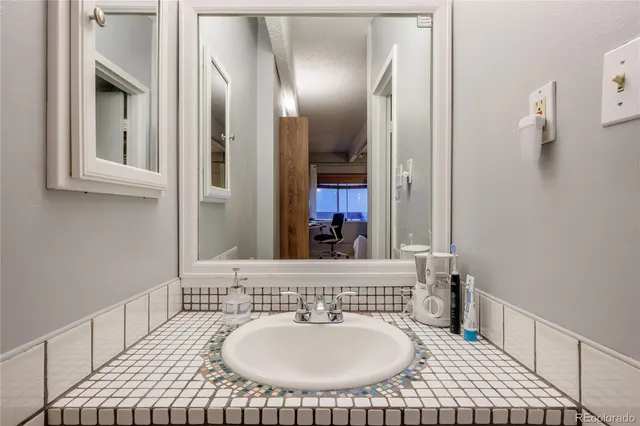 a bathroom with a sink and a mirror