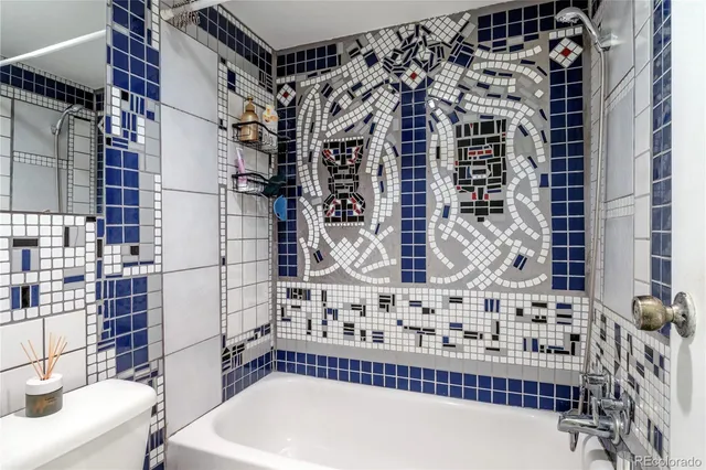 a bathroom with a bathtub and shower