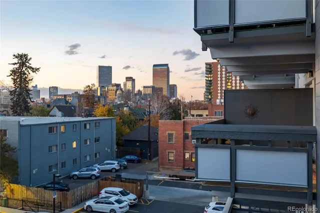 a dining room with furniture and a floor to ceiling window