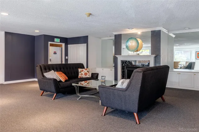 a living room with a table tennis table and a potted plant